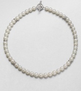 From the Pearl Crossover Collection. A lustrous strand of freshwater pearls accented with sterling silver crossover separators in a long, elegant design. 8mm-8.5mm round white freshwater pearlsSterling silverLength, about 36Toggle closureImported