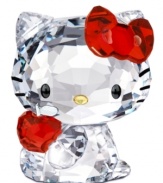 Cuter than ever, Hello Kitty clutches a shiny red apple in this irresistible Swarovski crystal figurine. With printed whiskers and her trademark red bow.