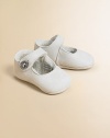 Darling, lamb shearling Mary Janes will keep her stylish little feet warm and cozy.Button closureLamb shearling upperRubber soleDry cleanImported