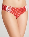 This retro polka dot bikini from Betsey Johnson was made with punky pin-ups in mind. Turn the boardwalk into a catwalk with a bright red lip and cat eye shades.