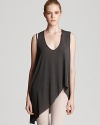 Channel of-the-moment edge in this forward tee from Helmut Lang featuring a relaxed silhouette and asymmetric hem.