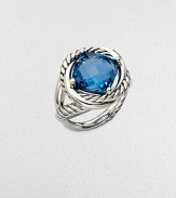 From the Infinity Collection. A richly colored, faceted blue topaz in a setting formed of intertwining smooth bands and cables of sterling silver.Blue topazSterling silverDiameter, about ½Imported