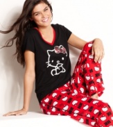 Relax in comfort and style with the help of an old friend. Hello Kitty's Graphic Cheer top and pajama pants set features a sparkly sequin bow on top of the front graphic and an all-over print down below.