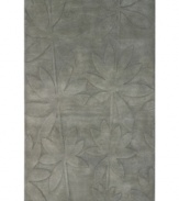 Expanding on classic rug motifs, this modern piece features a clean design of oversized leaves, virtually imprinted on an cool gray background. New Zealand wool is tufted by hand, creating a premium-quality rug with thick, dense pile.