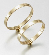 Two bold bangles, joined together, have an industrial screw-in design that enhances their simple drama.BrassDiameter, about 2.75Width, about 1.75Imported