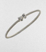 A charming, sterling silver cable design with a pretty diamond accented bow. Sterling silverDiamonds, .02 tcwDiameter, about 2½Slip-on styleImported 