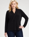 Understated and graceful, this sleek knit top has unlimited wardrobing possibilities.V necklineCrossover surplice bodiceEmpire seamed waistLong sleevesPolyester/elastaneDry cleanImported