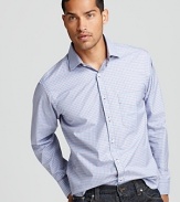 Dress for success in this sharp check button-down. The buttons boast cool contrast details and with its slim silhouette, this shirt really elevates your style.