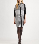 Geometric woven checks decorate this soft cocoon-style cape.Shawl collarAsymmetrical zip frontSide slitAbout 37 from shoulder to hem50% cotton/30% wool/20% polyesterDry cleanImportedModel shown is 5'9½ (176cm) wearing US size Small. 