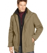 Stave off the rain in style with this water-resistant and insulated Calvin Klein jacket with removable hood.