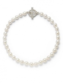 THE LOOKPearls collection10mm and 11mm white oval pearlsSingle strand silhouetteSterling silver setting Toggle closure THE MEASUREMENTLength, about 16ORIGINMade in USA