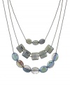 Add a touch of nature in this organic style. Kenneth Cole New York necklace features three stunning rows of square and oval-cut green beads strung from hematite tone mixed metal chains. Approximate length: 16 inches + 3-inch extender.