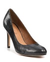 Stingray-embossed leather pumps from Corso Como boast round toes and slim heels.