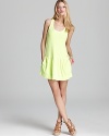 A high-voltage hue amps up this Juicy Couture tank dress. Team with a strappy neon bikini and hit the beach.