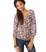 This peasant top from Lucky Brand Jeans lends feminine ease to worn-in jeans, thanks to an allover floral print and chic metallic trim.