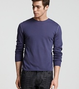 A super light - almost sheer - crewneck shirt in soft merino wool with contrast stitch details at the shoulder and elbows.