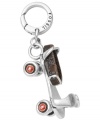 Transport yourself back to the 1950s with this vintage-inspired roller skate charm. Fossil's antique-themed style features red enamel wheels that actually spin and a real leather ankle strap. Set in silver tone mixed metal. Approximate drop: 1-1/4 inches.