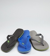 Classic kick-around beach sandals rendered in rugged rubber and accented with the Brazilian flag at the strap upper.