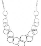 Let your look come full circle with the addition of this chic frontal necklace. Nine West design highlights interlocking cut-out circles on a matching chain. Crafted in silver tone mixed metal. Approximate length: 16 inches.