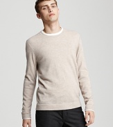 Contrast stitching and stripe trim accent this luxurious crewneck cashmere sweater from John Varvatos.