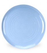 Like a blooming bed of forget-me-nots, this powder-blue porcelain serveware has a fresh, natural vibrance. A hand thrown texture gives the round platter the irresistible charm of traditional pottery.