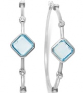 Classic earrings get a sparkly update. Victoria Townsend's stunning hoop earrings feature square-cut blue topaz (6-1/2 ct. t.w.) and sparkling diamond accents in sterling silver. Approximate diameter: 2 inches.