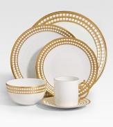 A beautiful saucer in fine Limoges porcelain, made entirely by hand and finished with individually-applied 14k gold along the pearl border. From the Perlee Gold Collection Porcelain 6½ diam. Dishwasher safe Imported 