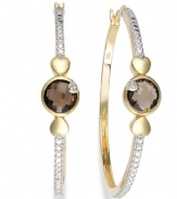 Stylish sophistication by Victoria Townsend. A traditional pair of hoop earrings gets played up by round-cut smokey topaz (2-5/8 ct. t.w.) and sparkling diamond accents. Set in 18k gold over sterling silver and sterling silver. Approximate diameter: 1-5/8 inches.