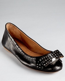 In the softest leather, Elie Tahari's Dalia flats showcase shining studs, juxtaposed by a feminine bow.