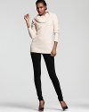 A chunky ribbed cowlneck and cable knit detail lend luxe to this chic sweater from C by Bloomingdale's.