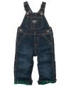 Denim Osh Kosh overalls with flannel lining are built with lots of pockets, authentic hardware, and classic vest back for long wearing fun.