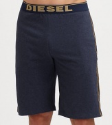 A casual elongated version with logo waistband and contrast piping. Elastic logo waistbandHits above kneeInseam, about 8CottonMachine washImported