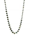 Captivatingly chic. Gorgeous green faceted glass accents in varying sizes add intrigue to Kenneth Cole New York's long station necklace. Crafted in hematite tone mixed metal. Approximate length: 42-1/2 inches.