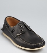 Laceless boat shoe stylings from John Varvatos Star USA, embellished with a moc toe, contrast topstitching and leather linings.