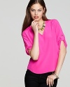 Add a vibrant pop of color to your blouse collection with this Amanda Uprichard top, articulated in rich silk.