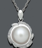 Prim and polished. This sophisticated pendant highlights a cultured freshwater pearl (9-10 mm) encircled by a pretty petal design accented with sparkling diamonds. Set in sterling silver. Approximate length: 18 inches. Approximate drop: 3/4 inch.