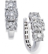 Prestige Unity adds a hint of glam to traditional hoop earrings. Several round-cut diamonds comprise a unique three-stone design (1 ct. t.w.) in a polished 14k white gold setting. Approximate diameter: 16 mm.