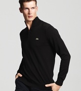 Preppy-meets-modern with a classic half-zip cotton sweater from Lacoste.