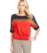 This Ellen Tracy blouse is modern and retro at once. Colorblocked panels make a stylish statement, while the easy silhouette and pleated waistband lend a fashion-forward shape to this chic must-have!