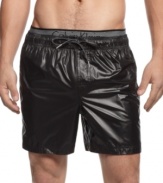 Shine on. Be a standout style star when you're playing in the sun and sand in these swim trunks from Calvin Klein.