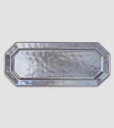 A unique mottling technique lends a hand-thumbed, hammered design to a beautiful metallic pewter serving tray with the look of an old-world favorite. 7¾W X 18L Dishwasher safe Imported