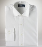 For a tailored, professional look, go for this handsome button down shirt, featuring a tailored fit with a contoured torso, narrow armholes and barrel cuffs. Crafted from fine cotton using single-needle stitching. Regent collar, button cuff and round hem. Embroidered logo at left chest.