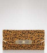 Sam Edelman's cheetah clutch is a fierce alternative to your basic black abg. Tuck the savage beauty under your arm with a colorful dress and head out for a wild night.