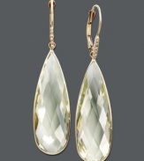 Pale green hues make the perfect splash. Earrings feature teardrop-shaped green amethyst (25 ct. t.w.) accented by a sparkling diamond. Crafted in 14k gold. Approximate drop: 2 inches.