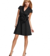 Chic wrap styling and an A-line skirt make this petite dress by Spense irresistible.