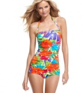 A tropical floral print makes a stylish statement on this Swim Solutions retro-inspired one piece swimsuit. Allover ruching and tummy control streamline the silhouette!