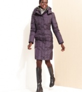 Bundle up in style with London Fog's quilted puffer. Luxurious faux fur lines the hood and collar of this cozy coat.