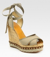 Secured by a grosgrain ribbon tie, this woven straw wedge has a canvas upper, hemp platform and studded leather trim. Straw wedge, 5 (125mm)Studded leather and hemp platform, 1½ (40mm)Compares to a 3½ heel (90mm)Canvas upperLeather lining and soleMade in SpainOUR FIT MODEL RECOMMENDS ordering true whole size; ½ sizes should order the next whole size up. 