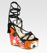 Vibrant, floral-print wedge with leather straps and braided suede laces that make their way up the ankle, concluding with tassels. Self-covered wedge, 5 (125mm)Covered platform, 2 (50mm)Compares to a 3 heel (75mm)Leather and suede upperLeather lining and solePadded insoleMade in ItalyOUR FIT MODEL RECOMMENDS ordering true size. 