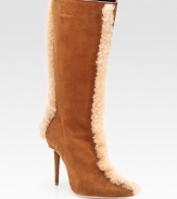 Buttery suede style with front-to-back shearling trim for a luxuriously plush look. Self-covered heel, 3 (75mm) Shaft, 13 Leg circumference, 15 Suede upper Shearling trim Leather lining Buffed leather sole Padded insole Made in ItalyOUR FIT MODEL RECOMMENDS ordering one half size up as this style runs small. 